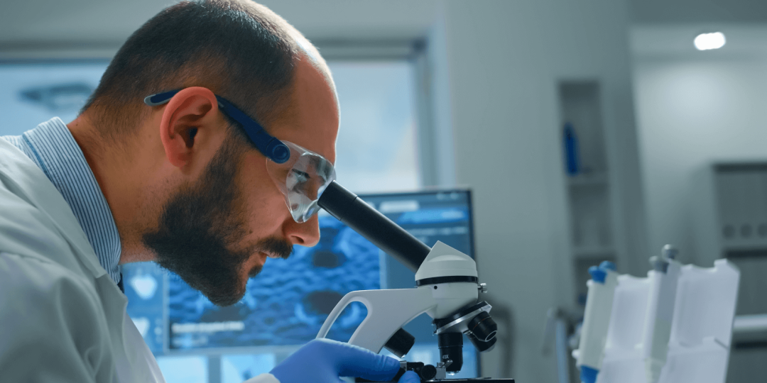 man-research-scientist-looking-samples-microscope-modern-equipped-laboratory